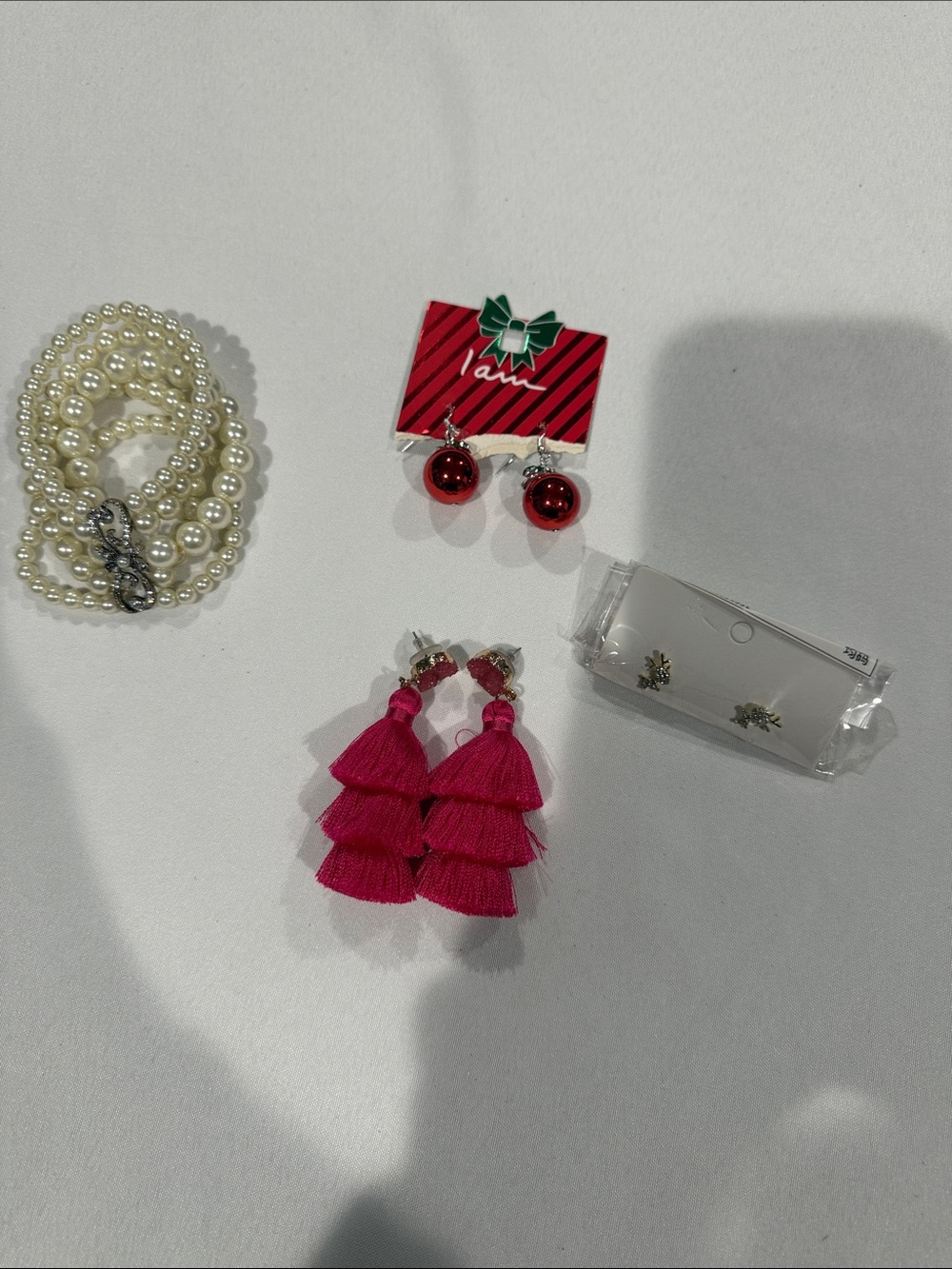 3 pairs of earrings and one bracelet.